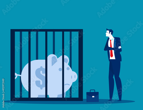 Businessman looking at a piggy bank in a cage