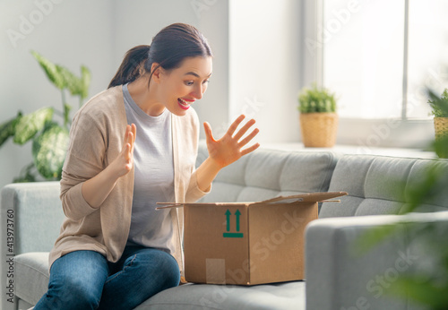 woman is unpacking cardboard