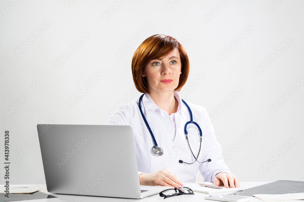 Family physician in white coat with stethoscope Family physician in white coat with stethoscope