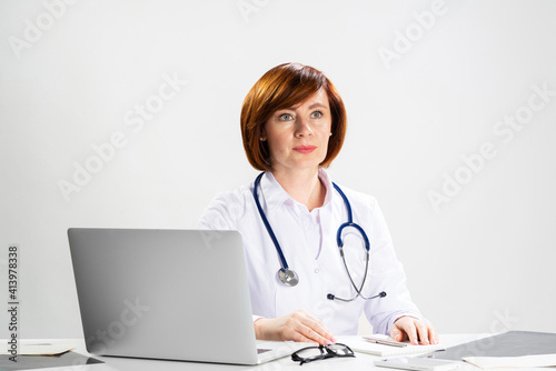 Family physician in white coat with stethoscope