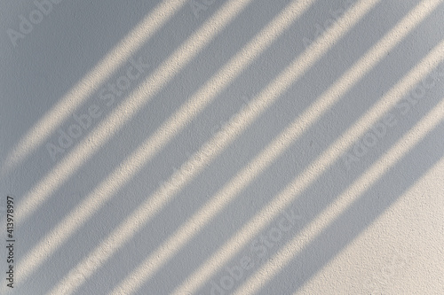Abstract  shadow lines from the curtain on the white wall. Background, wall art, design presentation