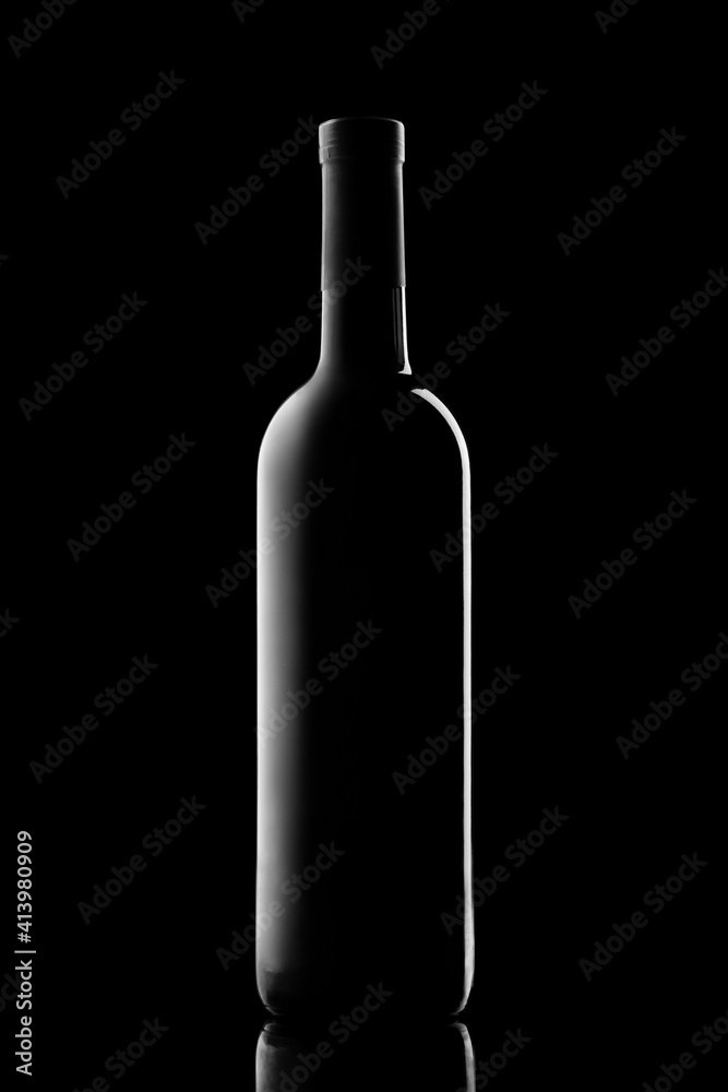 illuminated silhouette of a bottle with wine on a black background illuminated silhouette of a bottle with wine on a black background