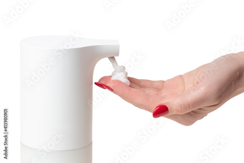 using an automatic dispenser to dispense liquid soap foam to wash your hands