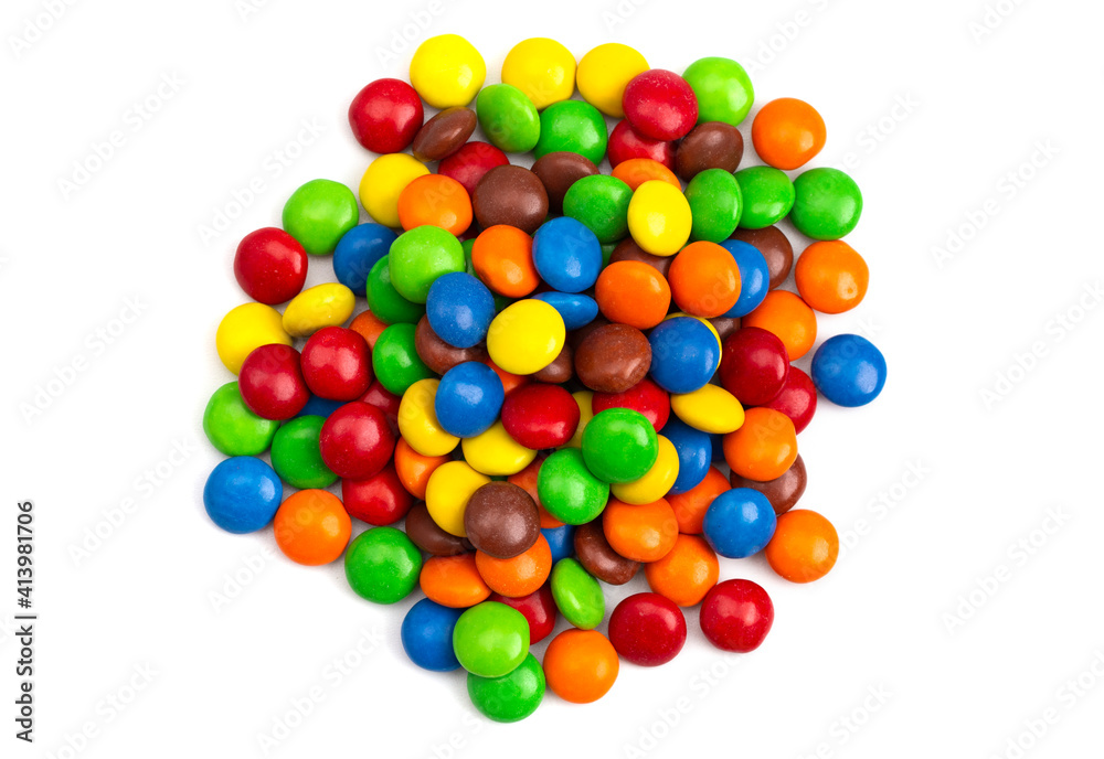 Pile of Rainbow Colored Candy Coated Chocolate Buttons Isolated on a White Background Pile of Rainbow Colored Candy Coated Chocolate Buttons Isolated on a White Background