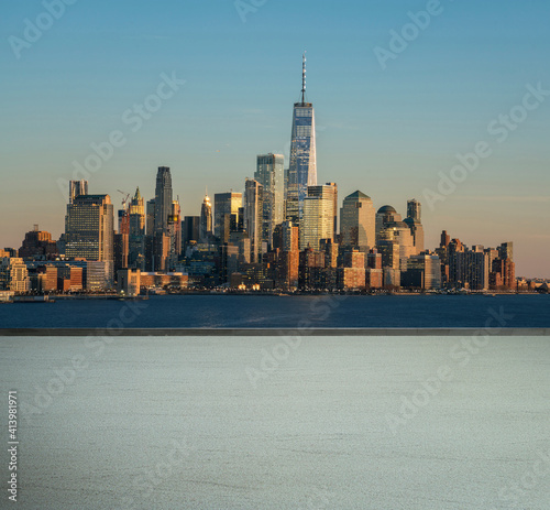 Automotive and parking lot concept  road of parking over New York cityscape river side at evening time background  United States  carpark and public park  copy space for Brochures and advertisement