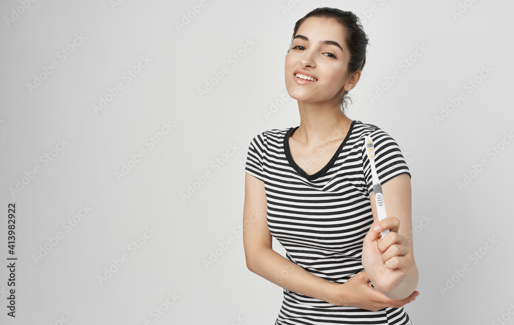 cheerful woman in striped t-shirt toothbrush hygiene cheerful woman in striped t-shirt toothbrush hygiene