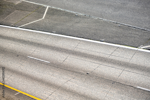 Vászonkép Concrete roadbed with distribution road markings