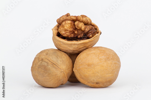 Walnuts with one half-open isolated on white background