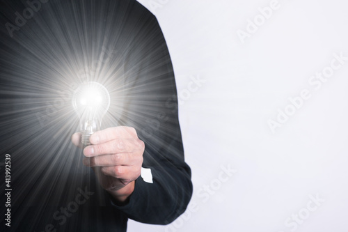 light bulb in hand	
