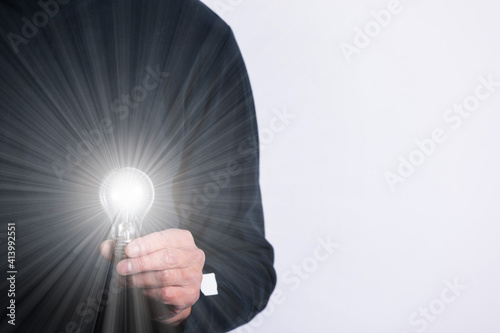 light bulb in hand	
