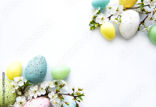 Colorful Easter eggs with spring blossom flowers