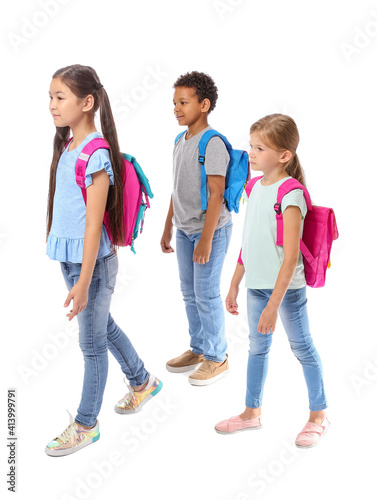 Little schoolchildren on white background