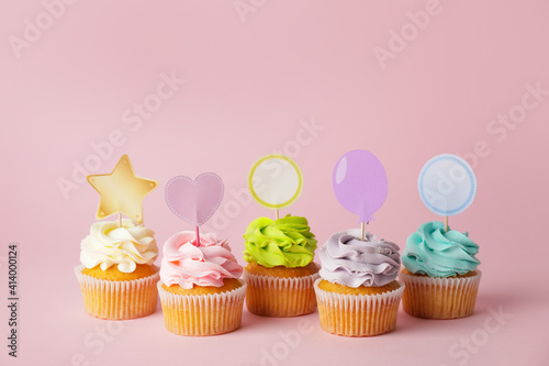 Tasty cupcakes with stylish...