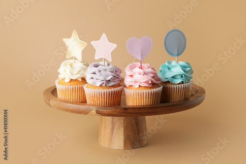 Tasty cupcakes with stylish...