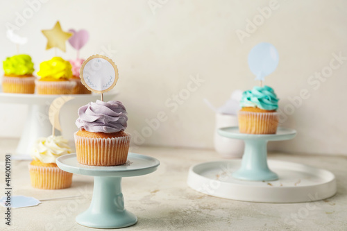 Tasty cupcakes with stylish...
