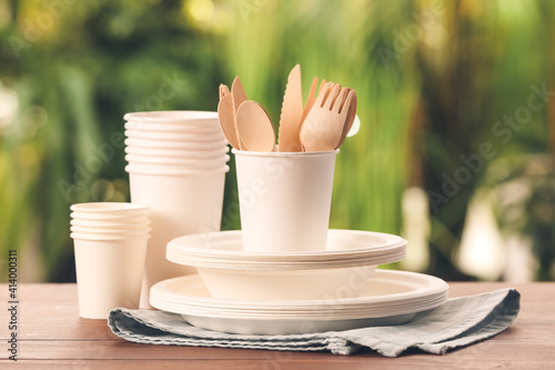 Eco tableware on table against blurred background