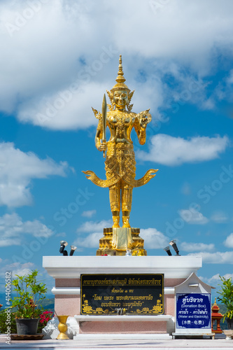 CHIANG SAEN,CHIANG RAI,THAILAND - FEBRUARY 9,2021 :Buddha image at Wat Phra dhat pha ngao and blue sky with clouds ,Chiang sean Thailand. photo