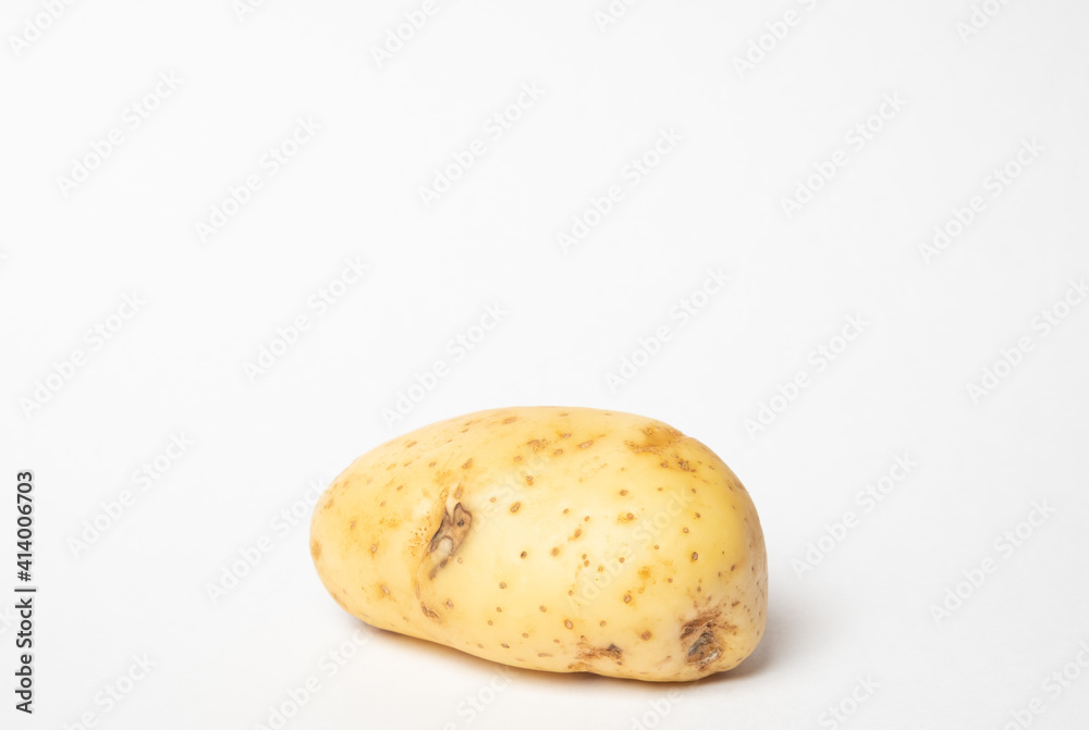Close up potato in isolated white background. Potatoes that are not retouched. Close up potato in isolated white background. Potatoes that are not retouched.