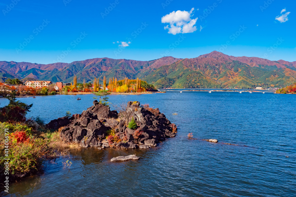 Japan panorama in autumn. Lake Kawaguchiko on the background of mountains. Mountains Of Japan. Kawaguchiko city on the lake. Bridge over lake. Fuji-Kawaguchiko. Five lakes of Fuji.