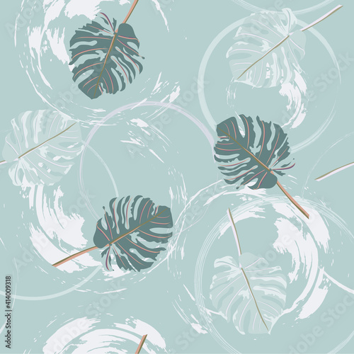 Seamless pattern with monstera leaves and brush strokest.  Floral background for printing on fabric, clothing, home textiles, wallpaper, gift wrapping.