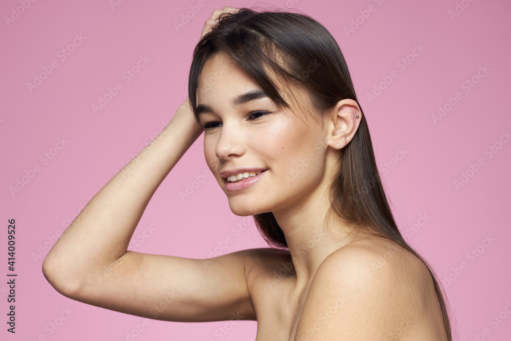 brunette bare shoulders clear skin body care pink background brunette bare shoulders clear skin body care pink background