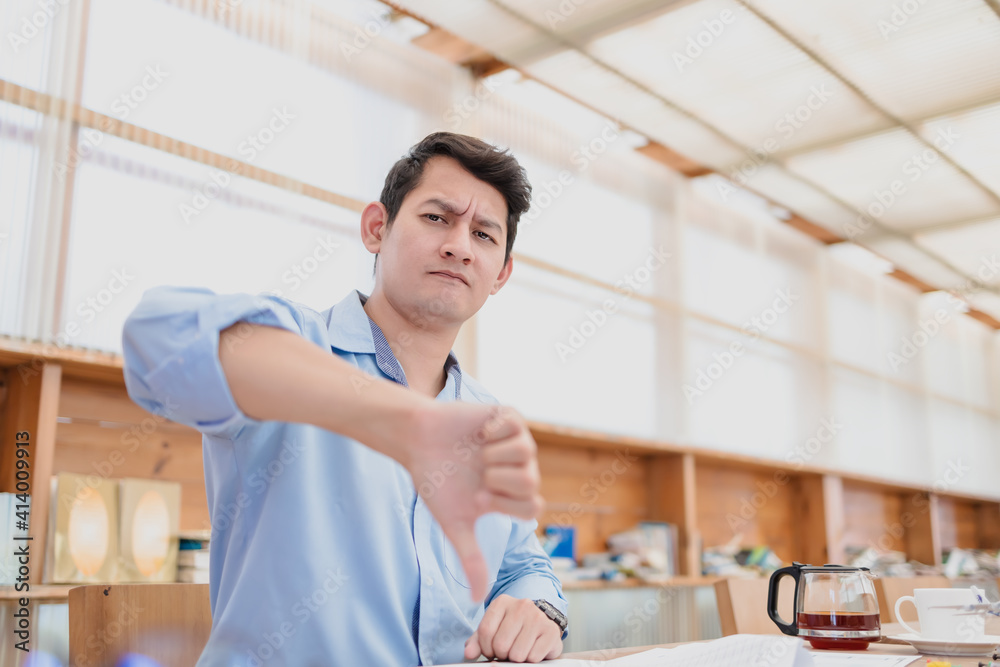 Fototapeta premium Business man show thumbs down