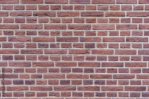 Red-brown brick wall as background