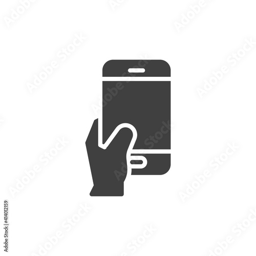 Hand holding phone vector icon. filled flat sign for mobile concept and web design. Taking selfie photo glyph icon. Symbol, logo illustration. Vector graphics