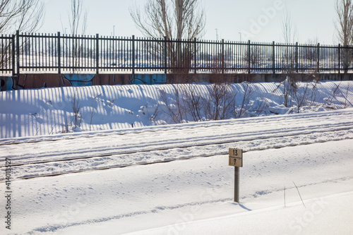 Snowy train tracks in Coslada on a cold winter's day. photo