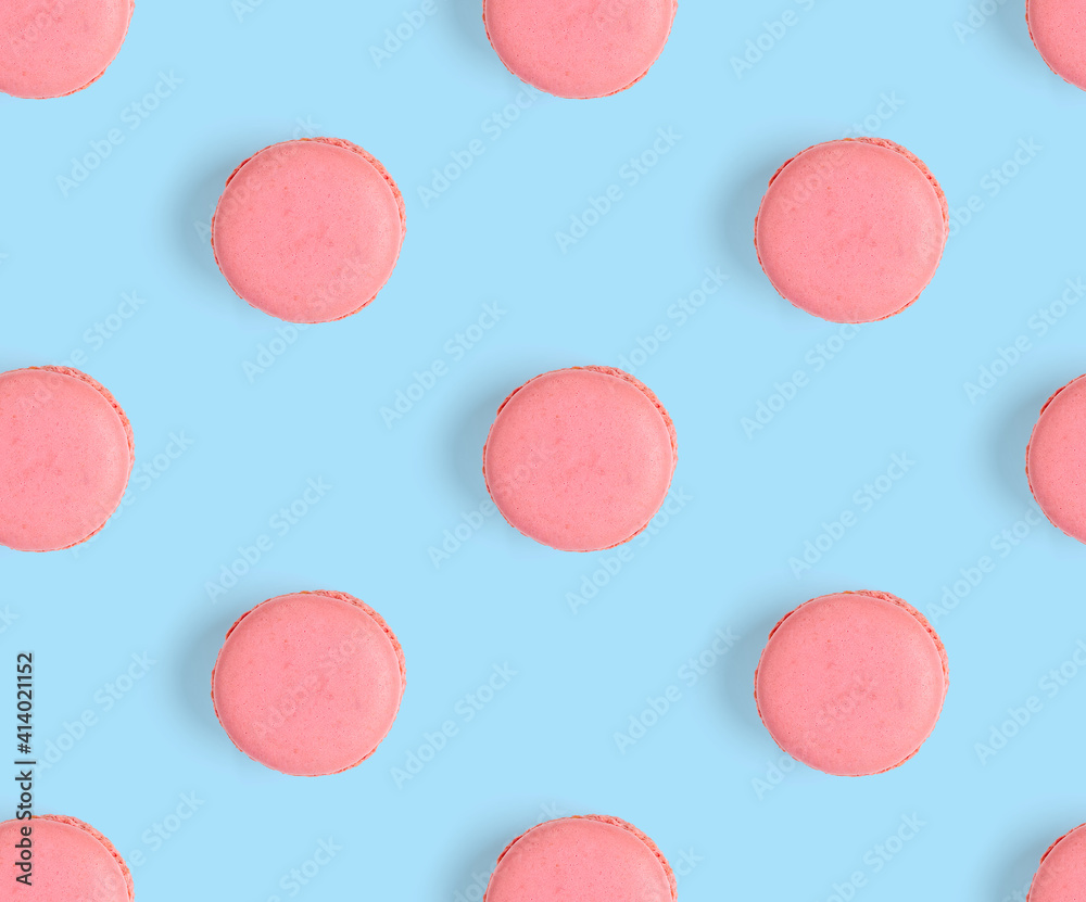 Fototapeta premium macarons seamless pattern. macarons isolated on blue background.