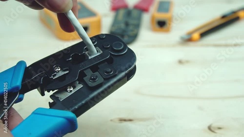 internet or telephone line cables and crimper, Twisting Cable Tool Twisted Pair Ethernet UTP Cat 5, Crimping RJ45 LAN cable, Stepping to crimping RJ45 connector.