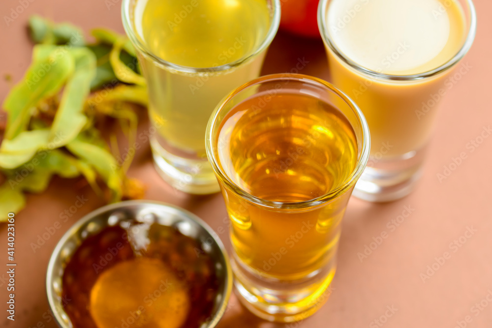 Fresh organic apple cider with apples and cinnamon over patel brown background. Close up three glasses. Fresh organic apple cider with apples and cinnamon over patel brown background. Close up three glasses.