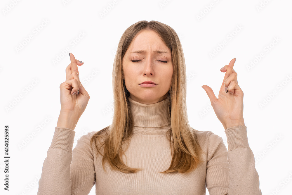 Attractive blond girl cross fingers good luck, praying for wish come true. Human emotions, gesture concept Attractive blond girl cross fingers good luck, praying for wish come true. Human emotions, gesture concept