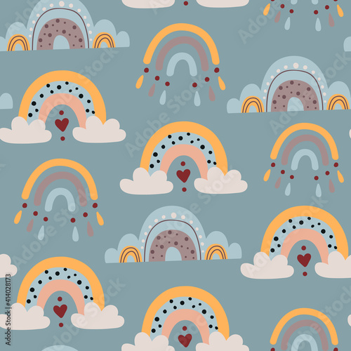 Seamless pattern with baby rainbows.