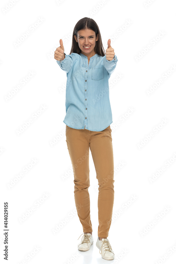 beautiful casual woman giving a double thumbs up