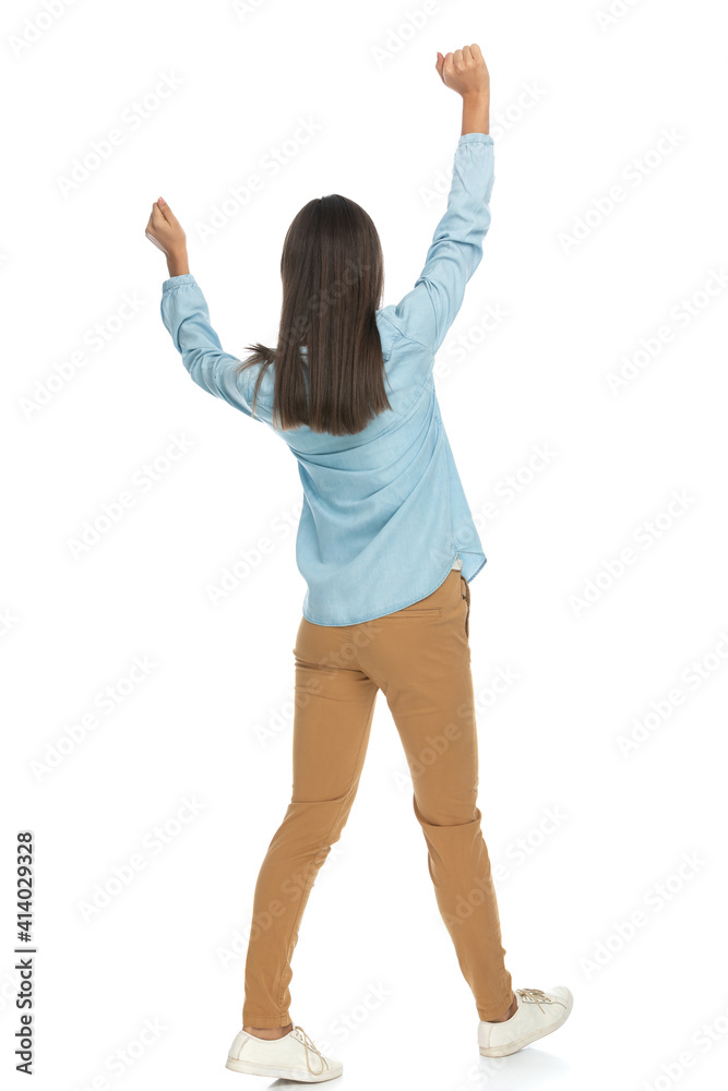 beautiful casual woman walking with her hands up beautiful casual woman walking with her hands up