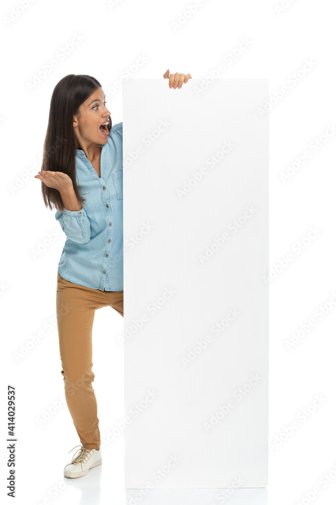 casual woman feeling shocked of the content of the billboard casual woman feeling shocked of the content of the billboard