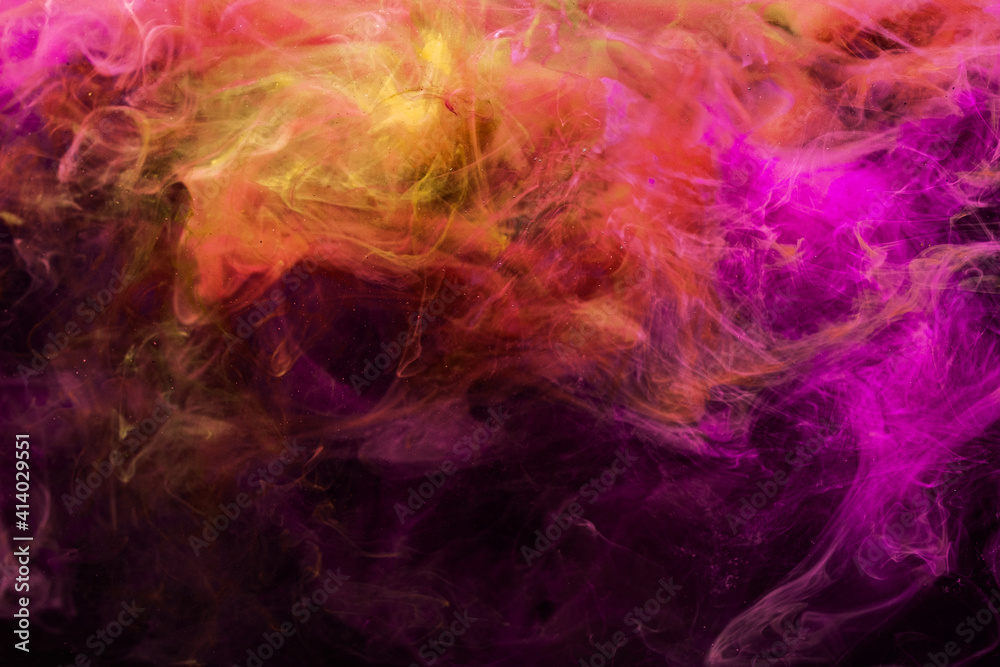 Paint in water. Colorful background. Abstract steam texture. Glowing vivid neon magenta pink purple orange mist mix spreading on dark.