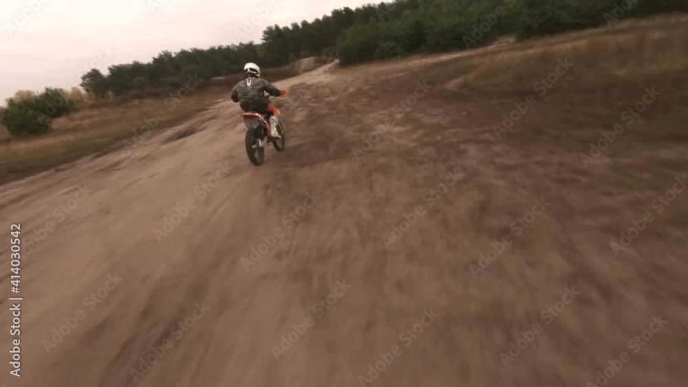 Motocross motorbike rides on the training track, aerial shoot Motocross motorbike rides on the training track, aerial shoot