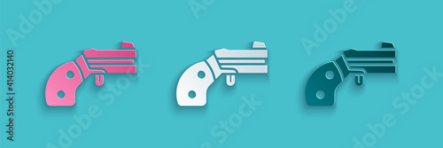 Paper cut Small gun revolver icon isolated on blue background. Pocket pistol for self-defense. Ladies revolver. Spy Weapon. Paper art style. Vector.