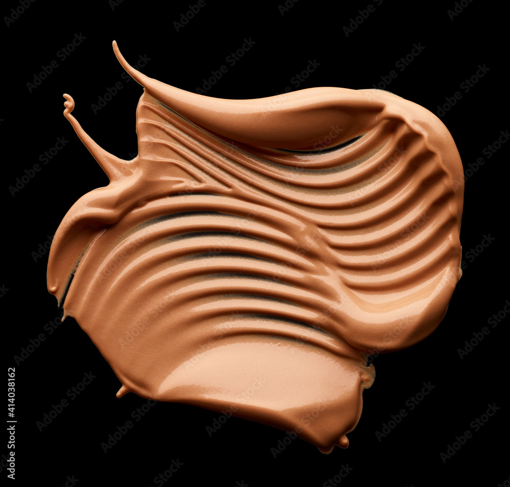 Makeup tone foundation smear isolated on black background Makeup tone foundation smear isolated on black background