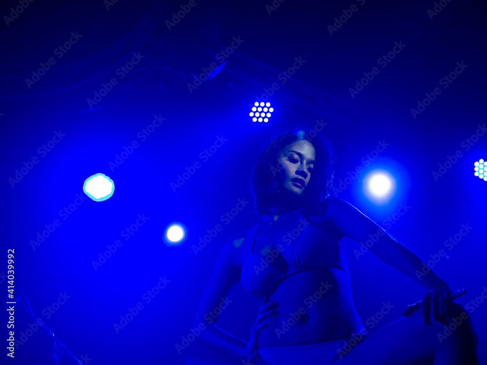 Asian sexy woman in bikini dancing show on stage. Asian sexy woman in bikini dancing show on stage.