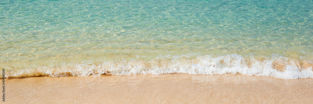 Sea with soft waves and sandy beach. Travel, vacation concept. Banner.