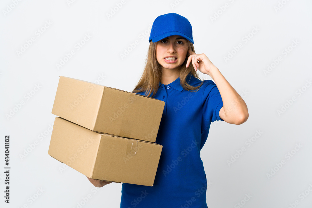 Young delivery woman over isolated white background frustrated and covering ears Young delivery woman over isolated white background frustrated and covering ears