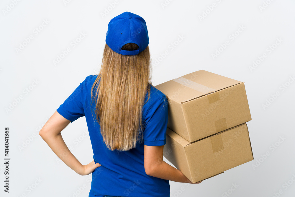 Young delivery woman over isolated white background in back position