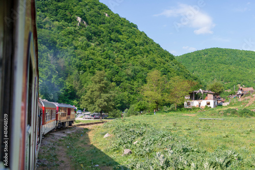 Old train traveling through the mountains