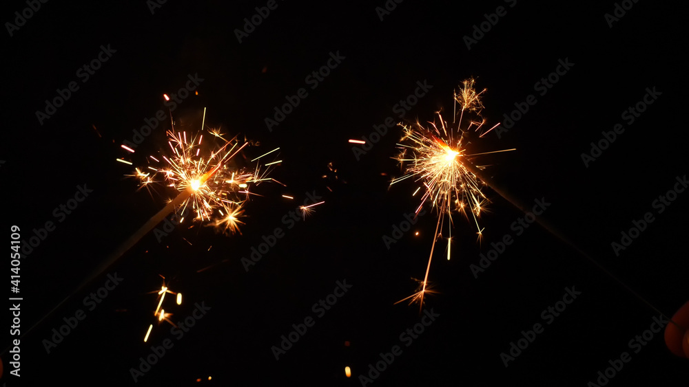 Sparkling stars burning  on black background. Movie suitable to satisfy celebrations and holidays.