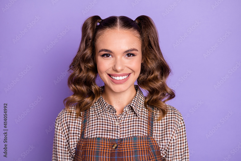 Portrait of adorable curly hairstyle young girl beaming smile look camera isolated on purple color background