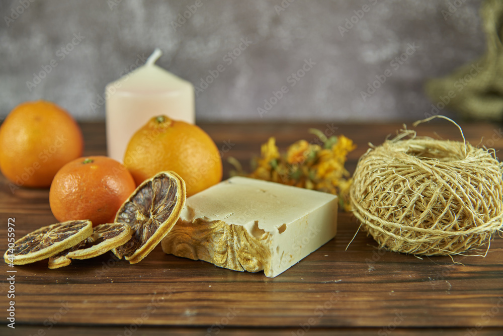 Handmade natural soap and various decorative items on the wooden countertop.