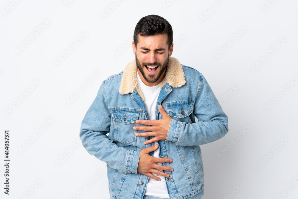 Young handsome man with beard isolated on white background smiling a lot Young handsome man with beard isolated on white background smiling a lot